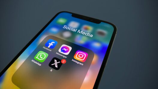 a close up of a cell phone with social media icons