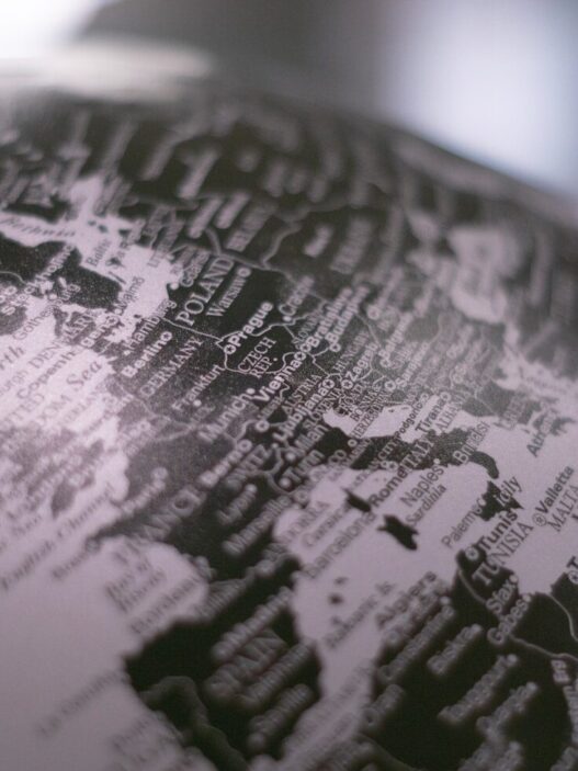 grayscale photo of desk globe